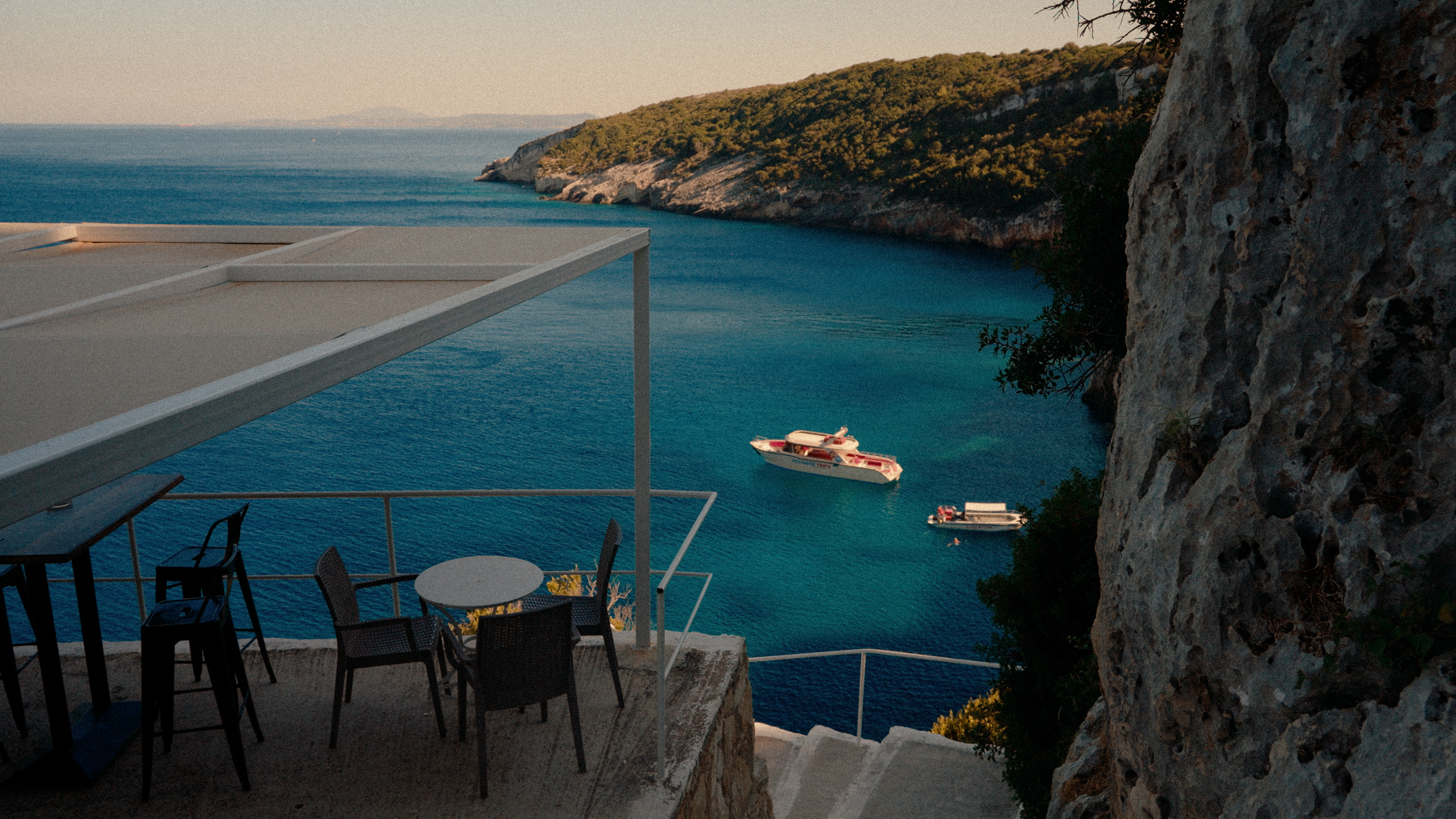 Boats anchored in a turquoise bay on Zakynthos, Greece